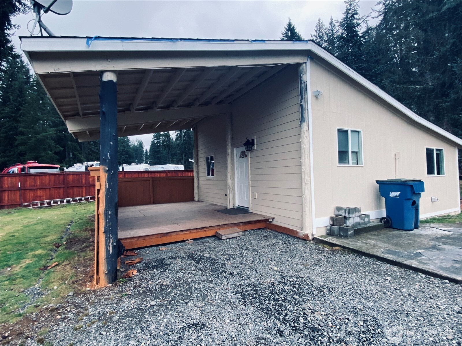 20314 Gun Club Road, Unit B Granite Falls, WA 98252 - Photo 1 of 10 a view of a patio with table and chairs potted plants