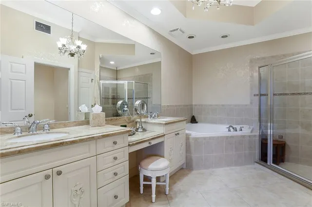 a spacious bathroom with a granite countertop sink a toilet a large mirror and shower