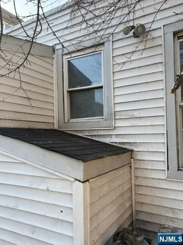 a view of a backyard with large trees