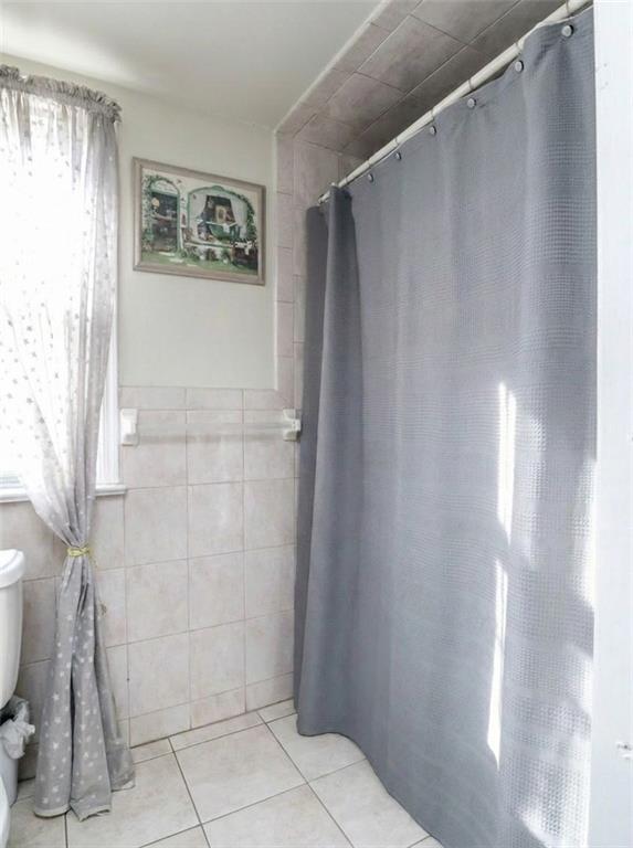 636 Holmdel Road Hazlet, NJ 07730 - Photo 33 of 47 a bathroom with a shower and a toilet