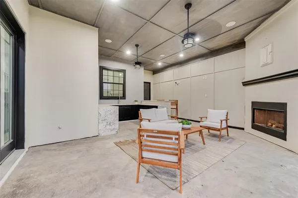 a view of a livingroom with furniture and a fireplace