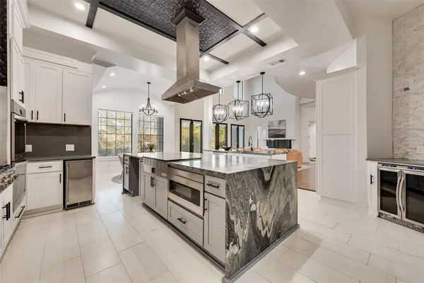 a kitchen with stainless steel appliances granite countertop a stove and a sink