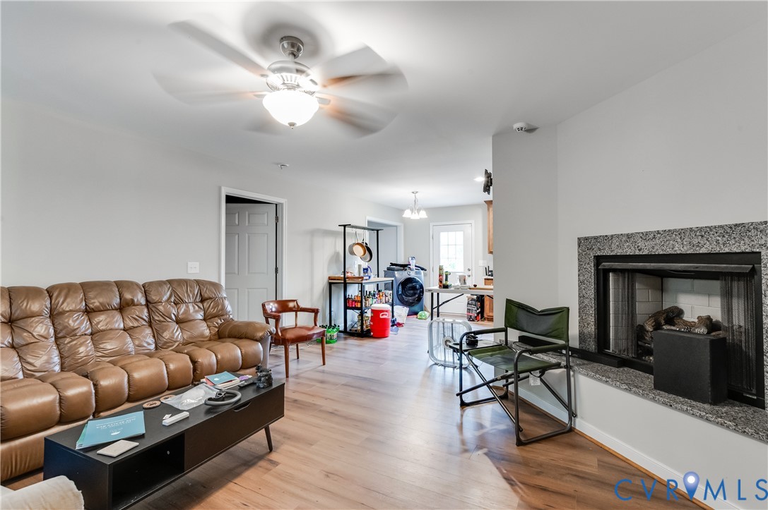 24580 St James Road Jetersville, VA 23083 - Photo 5 of 25 Living room featuring wood-finish flooring, a ceil