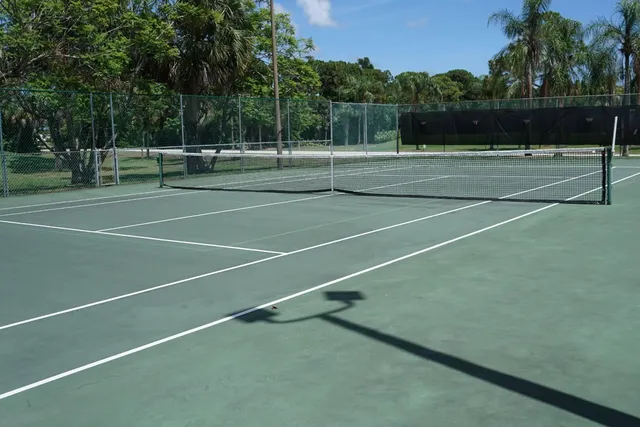 a view of an outdoor space and tennis court