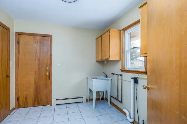a view of a kitchen with furniture and a window
