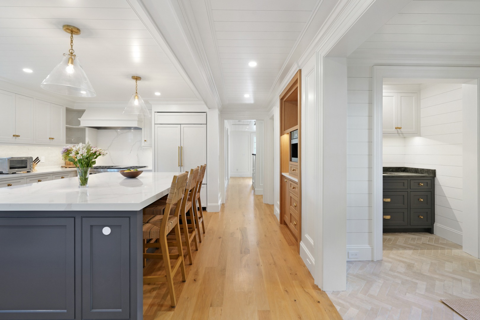 56 North Summer Street Edgartown, MA 02539 - Photo 18 of 77 a kitchen with stainless steel appliances kitchen island granite countertop a refrigerator and a sink