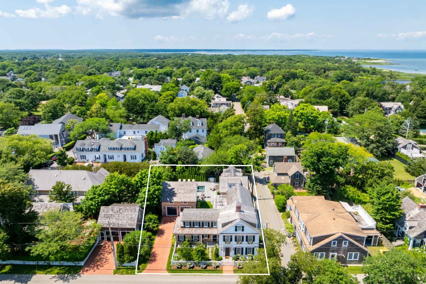56 North Summer Street Edgartown, MA 02539 - Photo 2 of 77 an aerial view of residential houses with outdoor space and trees all around