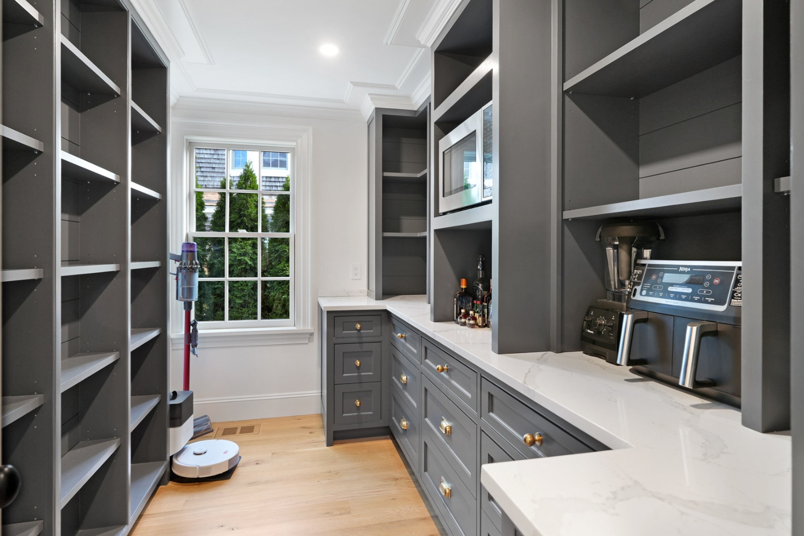 56 North Summer Street Edgartown, MA 02539 - Photo 22 of 77 a kitchen with granite countertop lots of clutter and stainless steel appliances