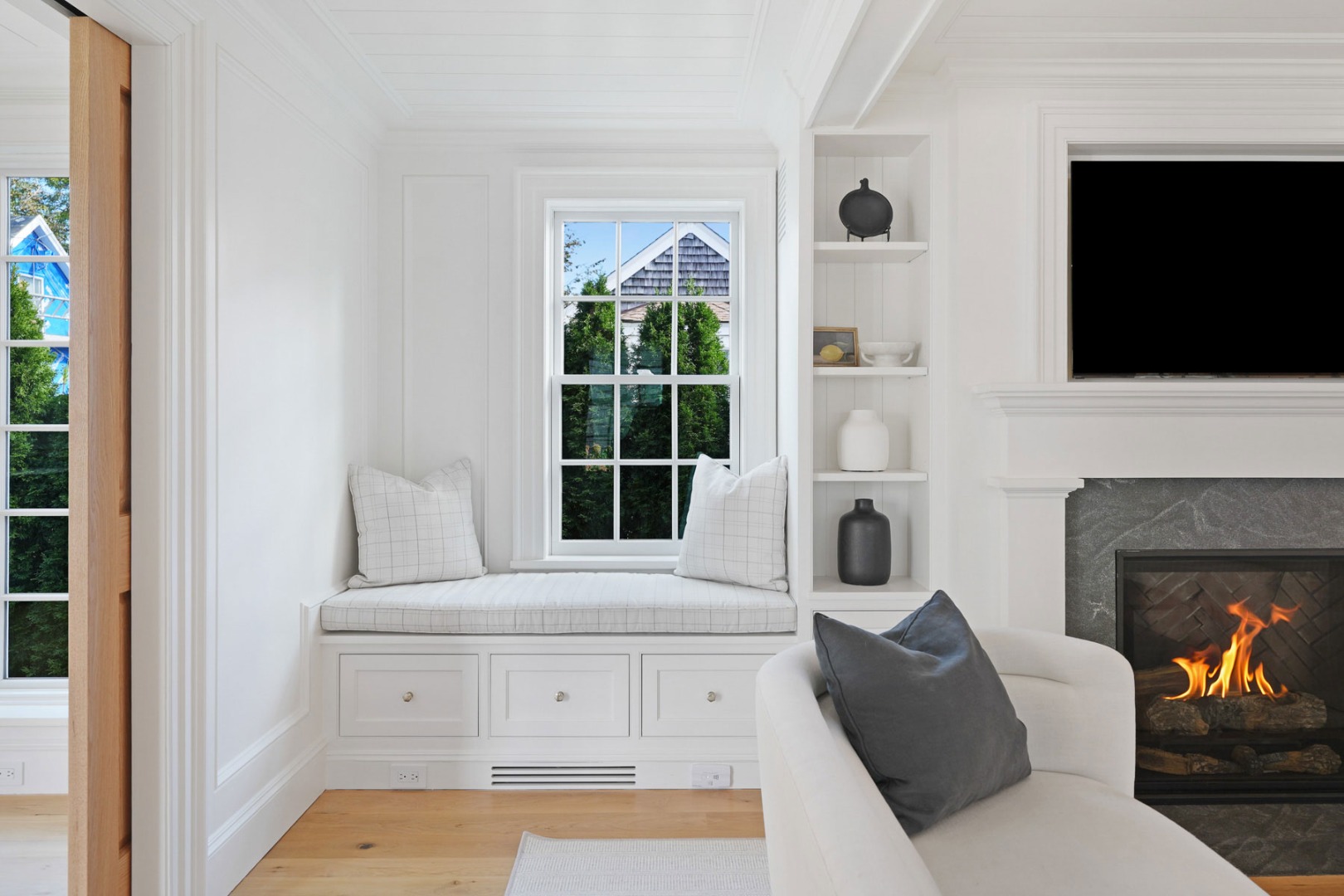 56 North Summer Street Edgartown, MA 02539 - Photo 27 of 77 a living room with furniture a flat screen tv and a fireplace