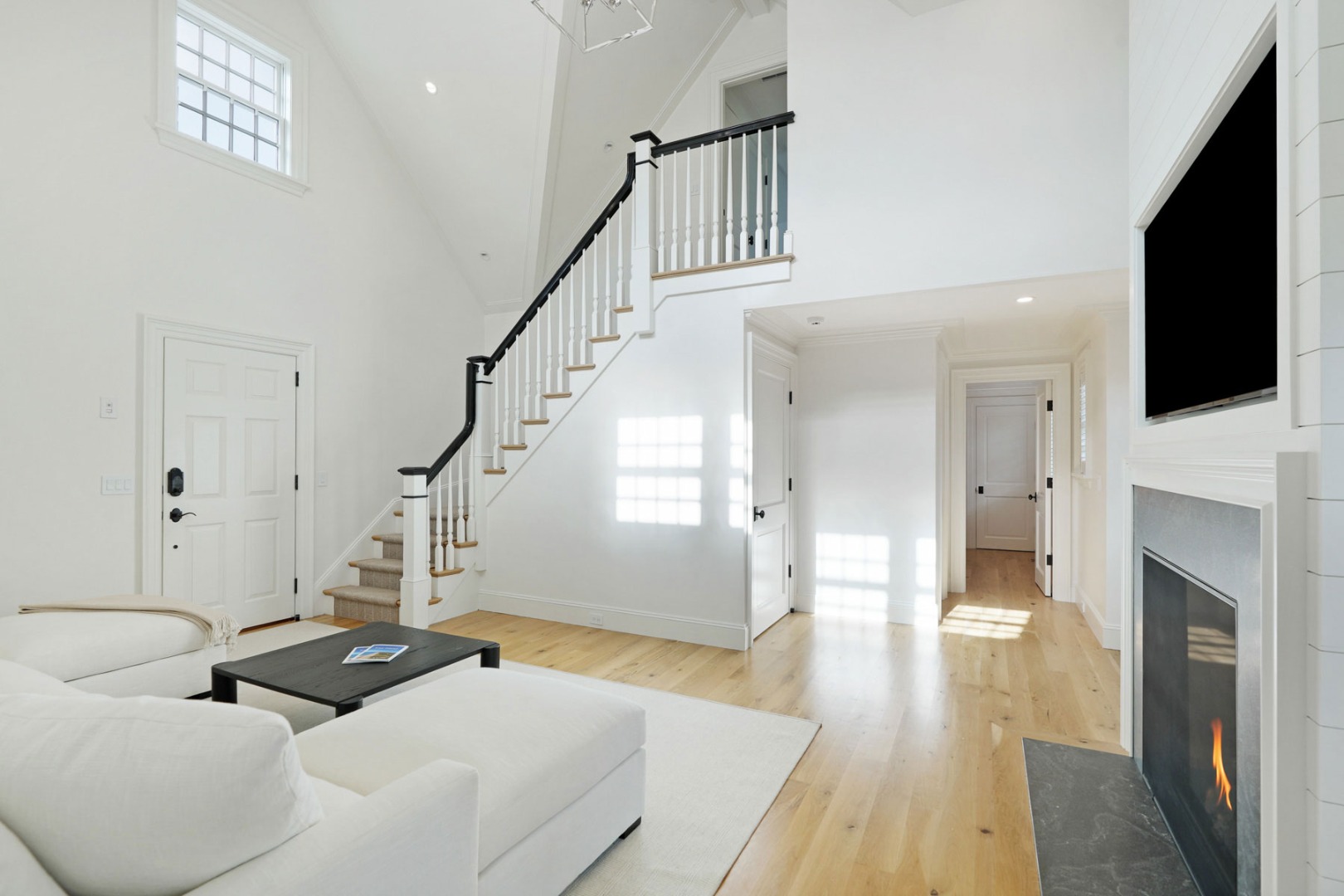 56 North Summer Street Edgartown, MA 02539 - Photo 28 of 77 a living room with furniture and a fireplace