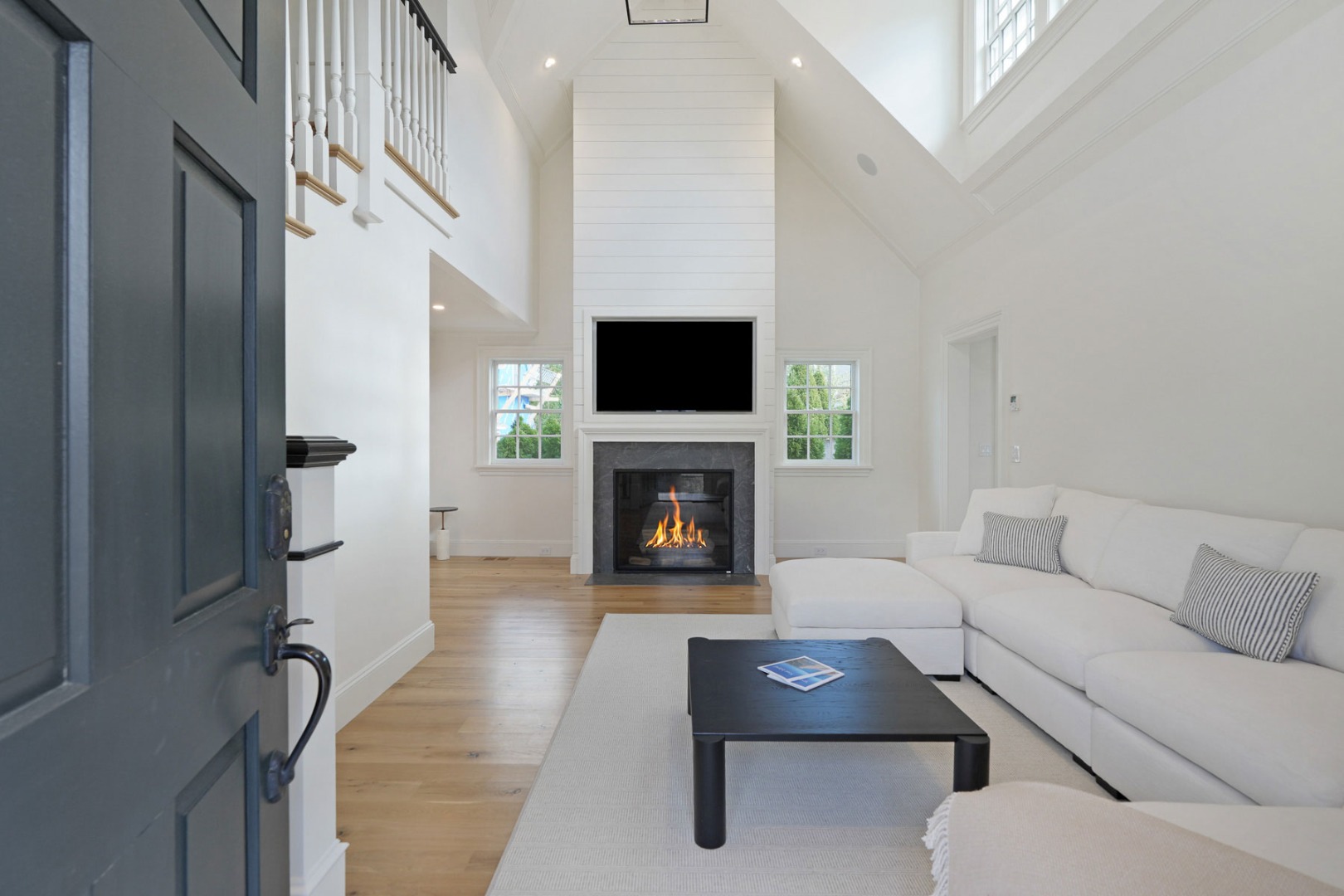 56 North Summer Street Edgartown, MA 02539 - Photo 31 of 77 a living room with furniture and a fireplace