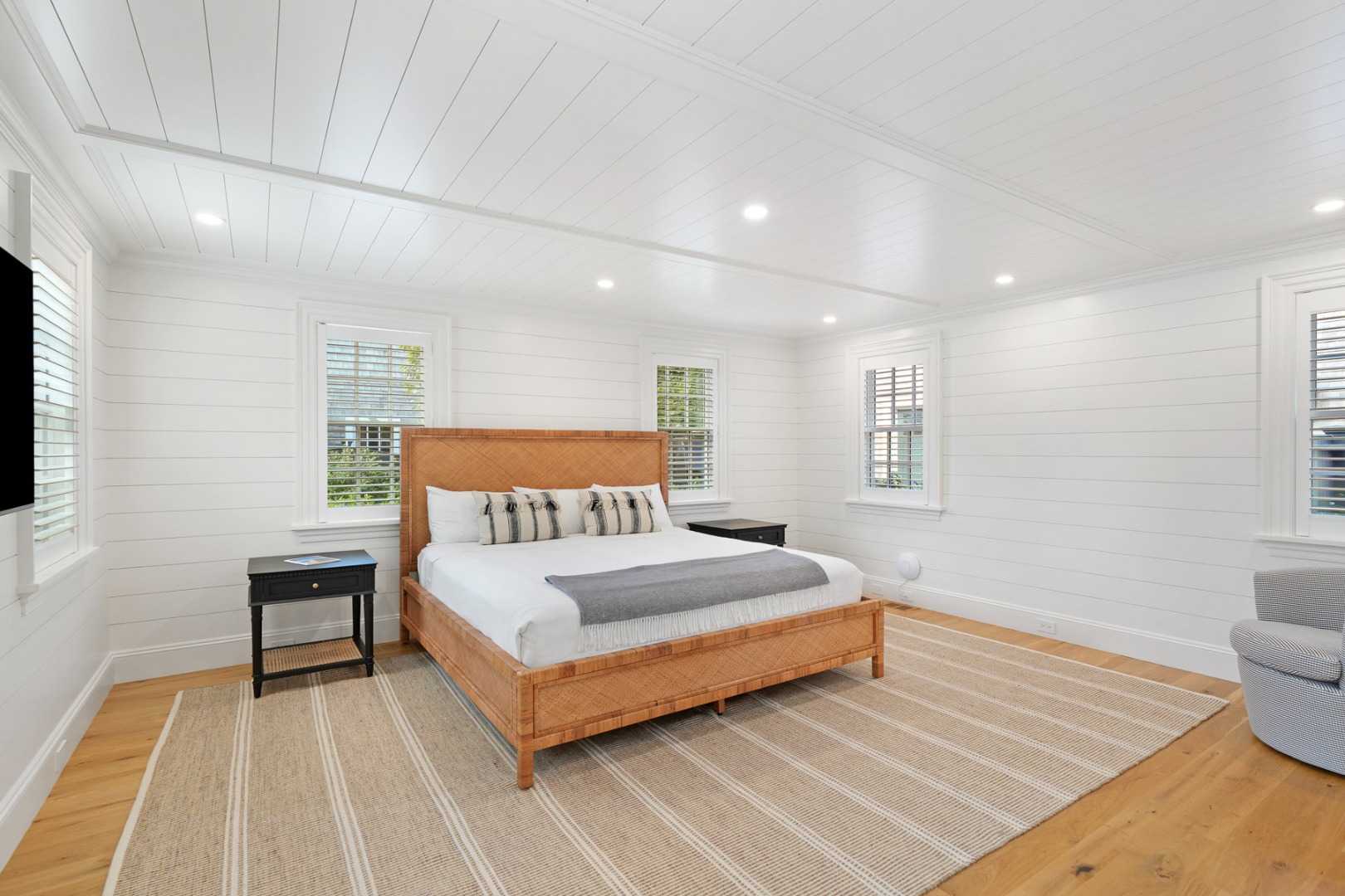 56 North Summer Street Edgartown, MA 02539 - Photo 36 of 77 a spacious bedroom with a bed and a couch