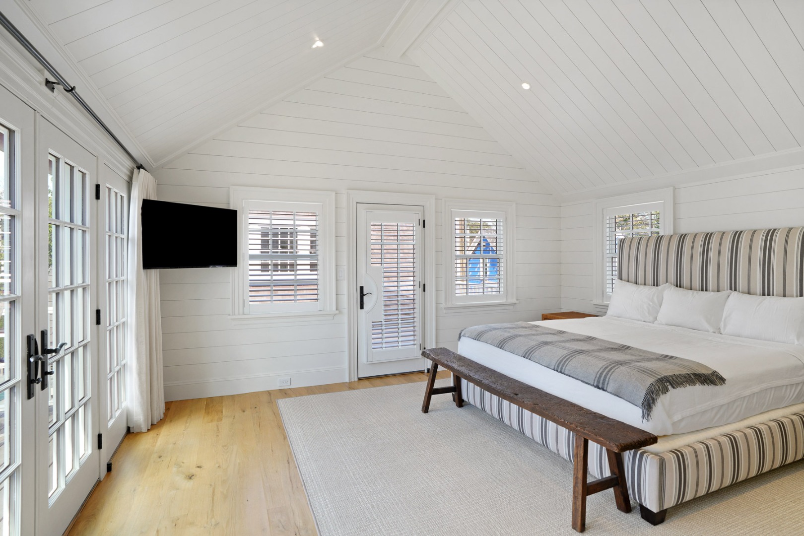 56 North Summer Street Edgartown, MA 02539 - Photo 40 of 77 a spacious bedroom with a bed and a flat screen tv