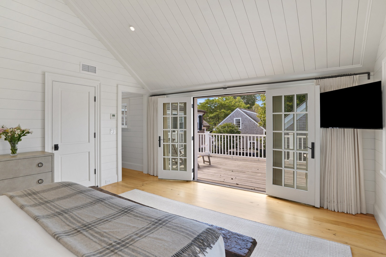 56 North Summer Street Edgartown, MA 02539 - Photo 41 of 77 a view of a bedroom with wooden floor and windows