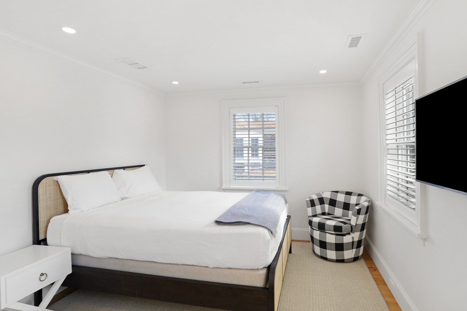 56 North Summer Street Edgartown, MA 02539 - Photo 50 of 77 a bedroom with a bed and a flat screen tv