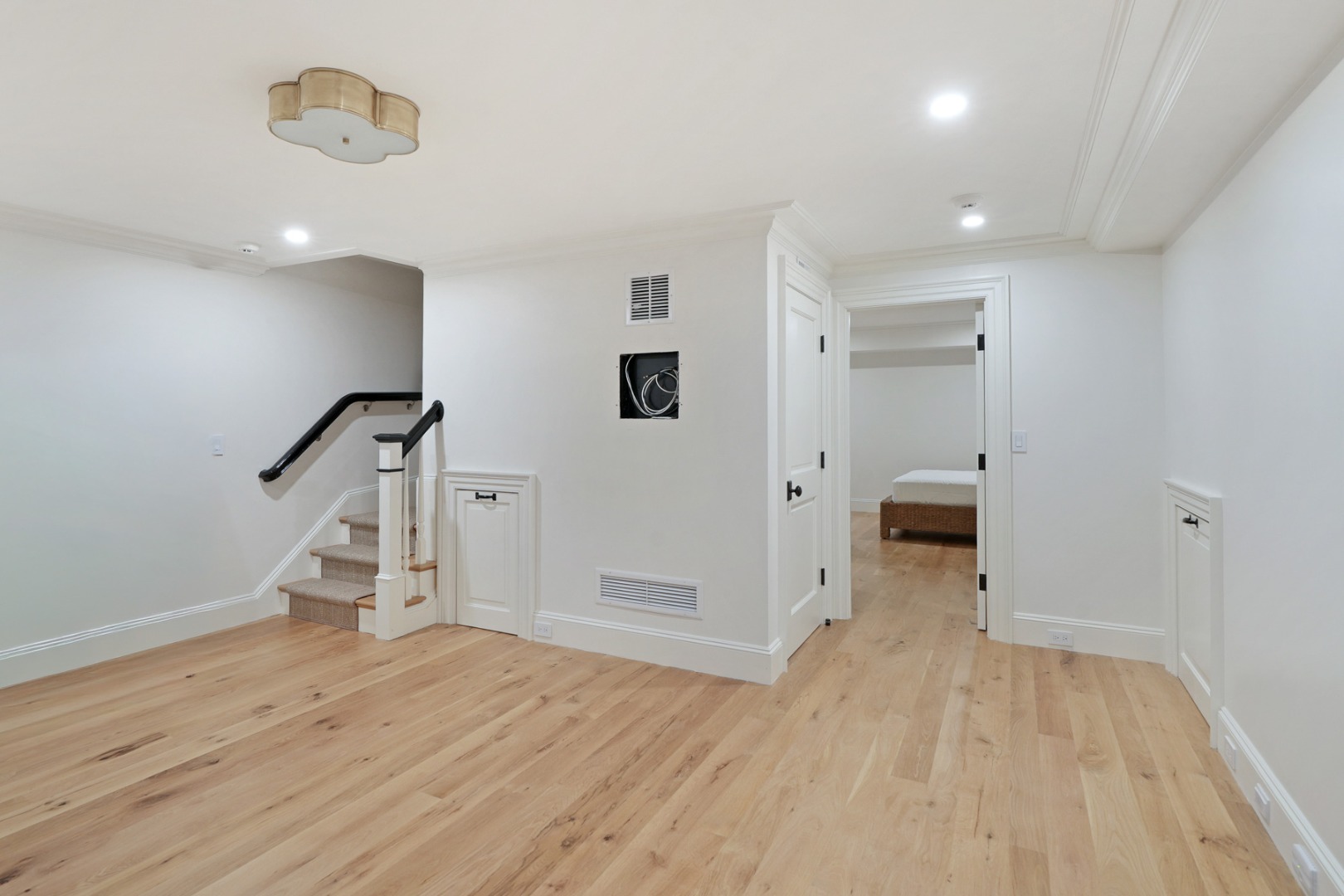 56 North Summer Street Edgartown, MA 02539 - Photo 65 of 77 an empty room with wooden floor and windows