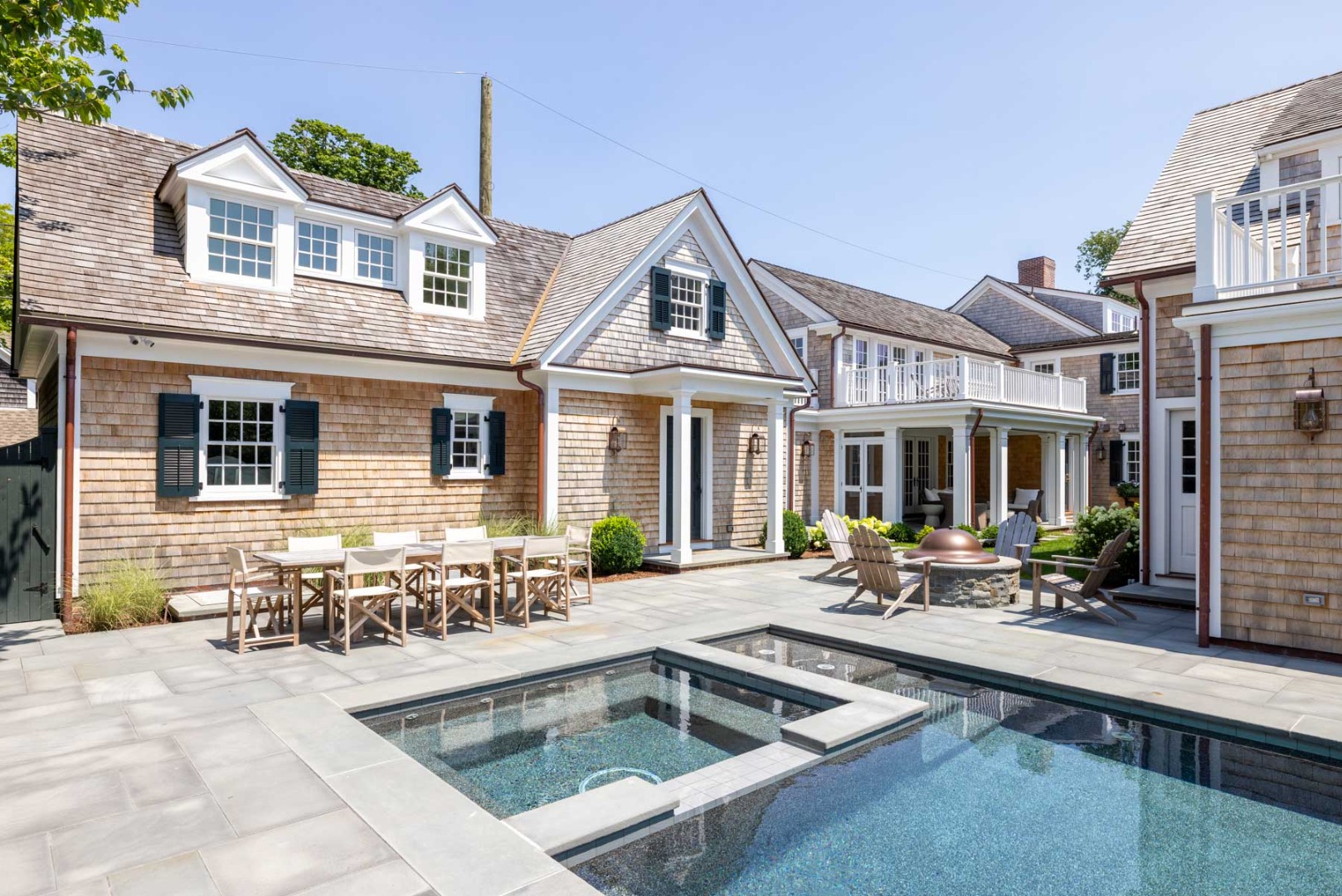 56 North Summer Street Edgartown, MA 02539 - Photo 9 of 77 a front view of a house with swimming pool and furniture