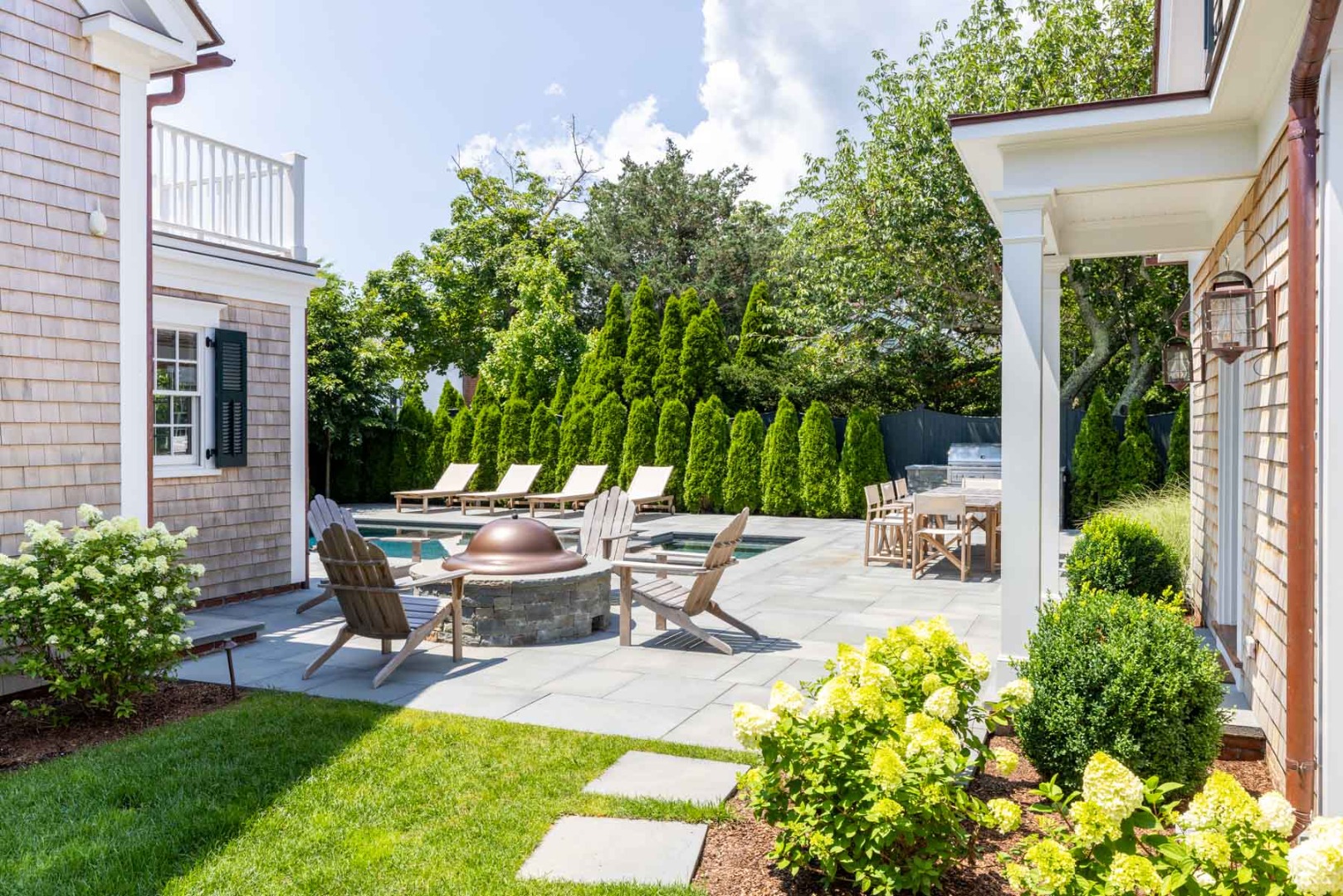 56 North Summer Street Edgartown, MA 02539 - Photo 10 of 77 a view of a patio with chairs and potted plants