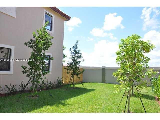 Homestead Homestead, FL 33033 - Photo 7 of 19 a view of a house with a backyard