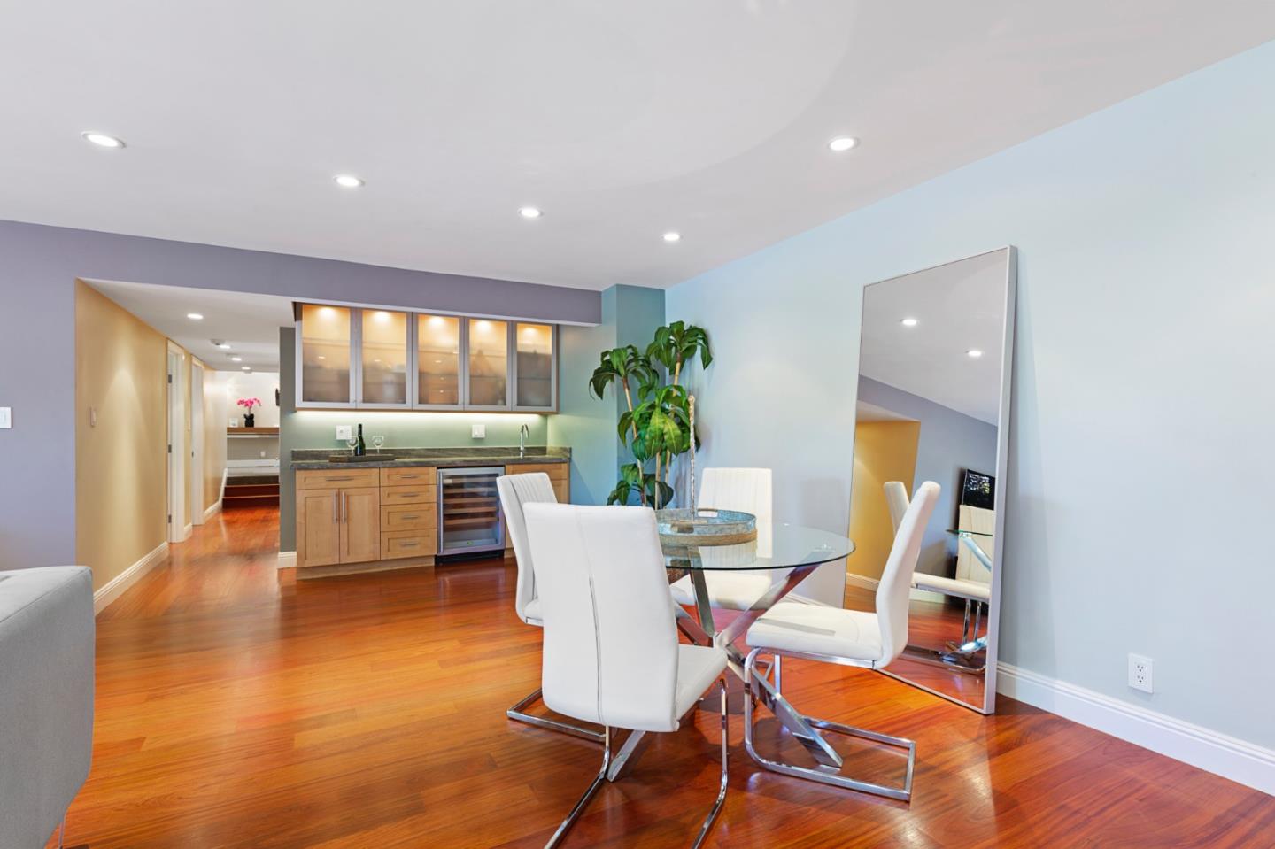 36 Tobin Clark Drive Hillsborough, CA 94010 - Photo 11 of 50 a view of a dining room with furniture a potted plant and wooden floor