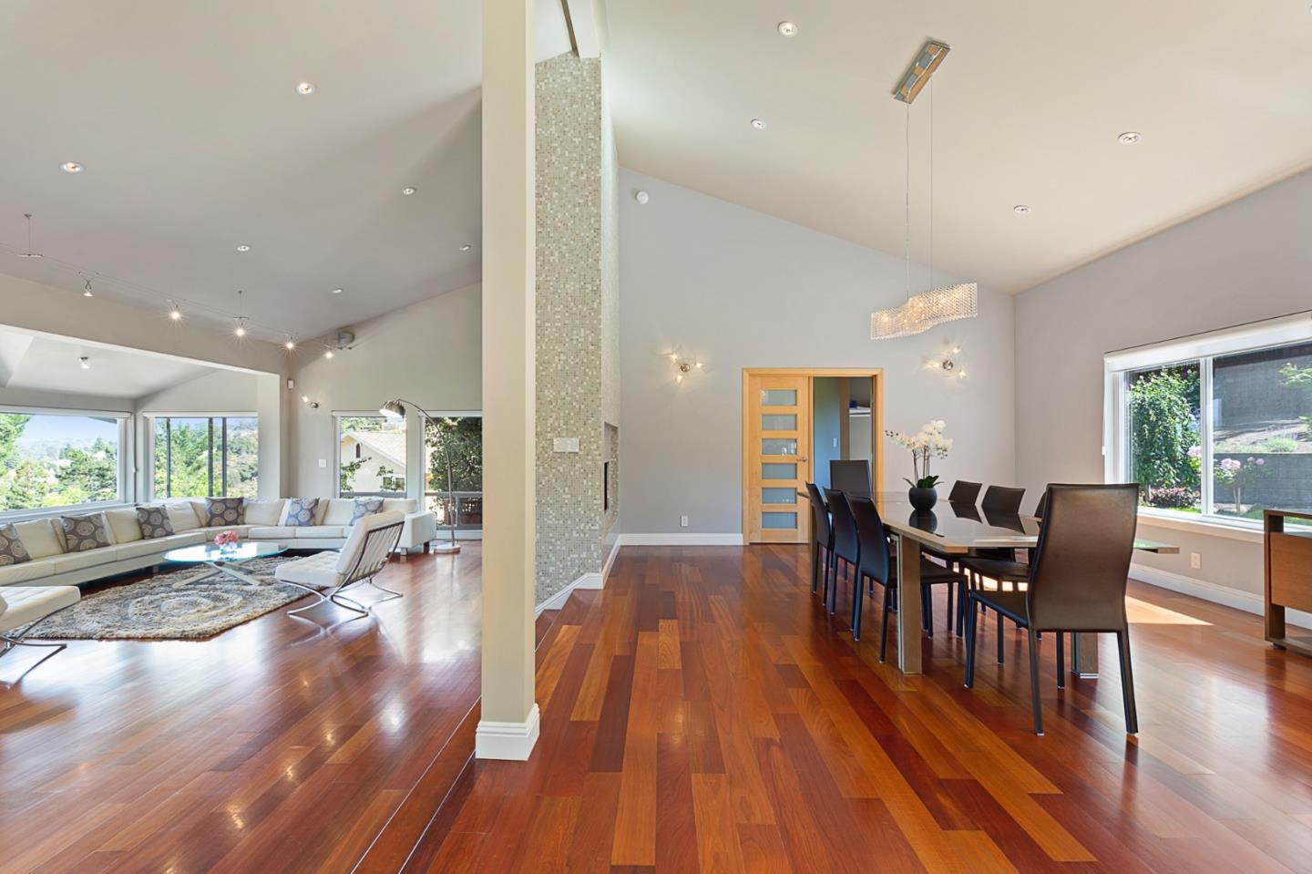 36 Tobin Clark Drive Hillsborough, CA 94010 - Photo 18 of 50 a view of a dining room and livingroom with furniture wooden floor a chandelier