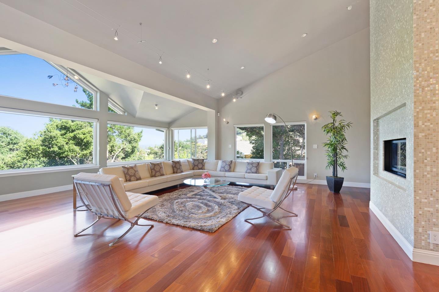 36 Tobin Clark Drive Hillsborough, CA 94010 - Photo 19 of 50 a living room with furniture large windows and wooden floor