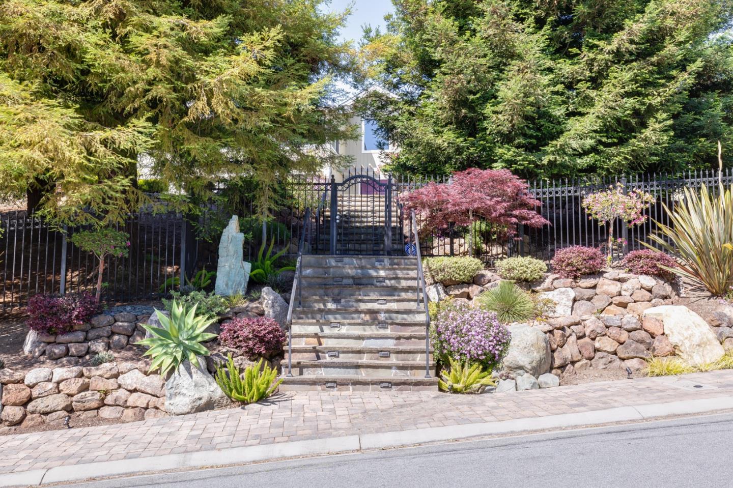 36 Tobin Clark Drive Hillsborough, CA 94010 - Photo 3 of 50 a front view of a house with a yard