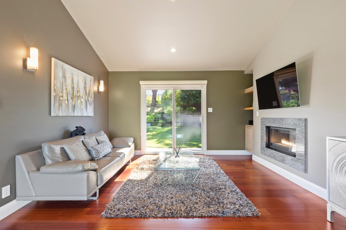 36 Tobin Clark Drive Hillsborough, CA 94010 - Photo 33 of 50 a living room with furniture or flat screen tv and a fireplace
