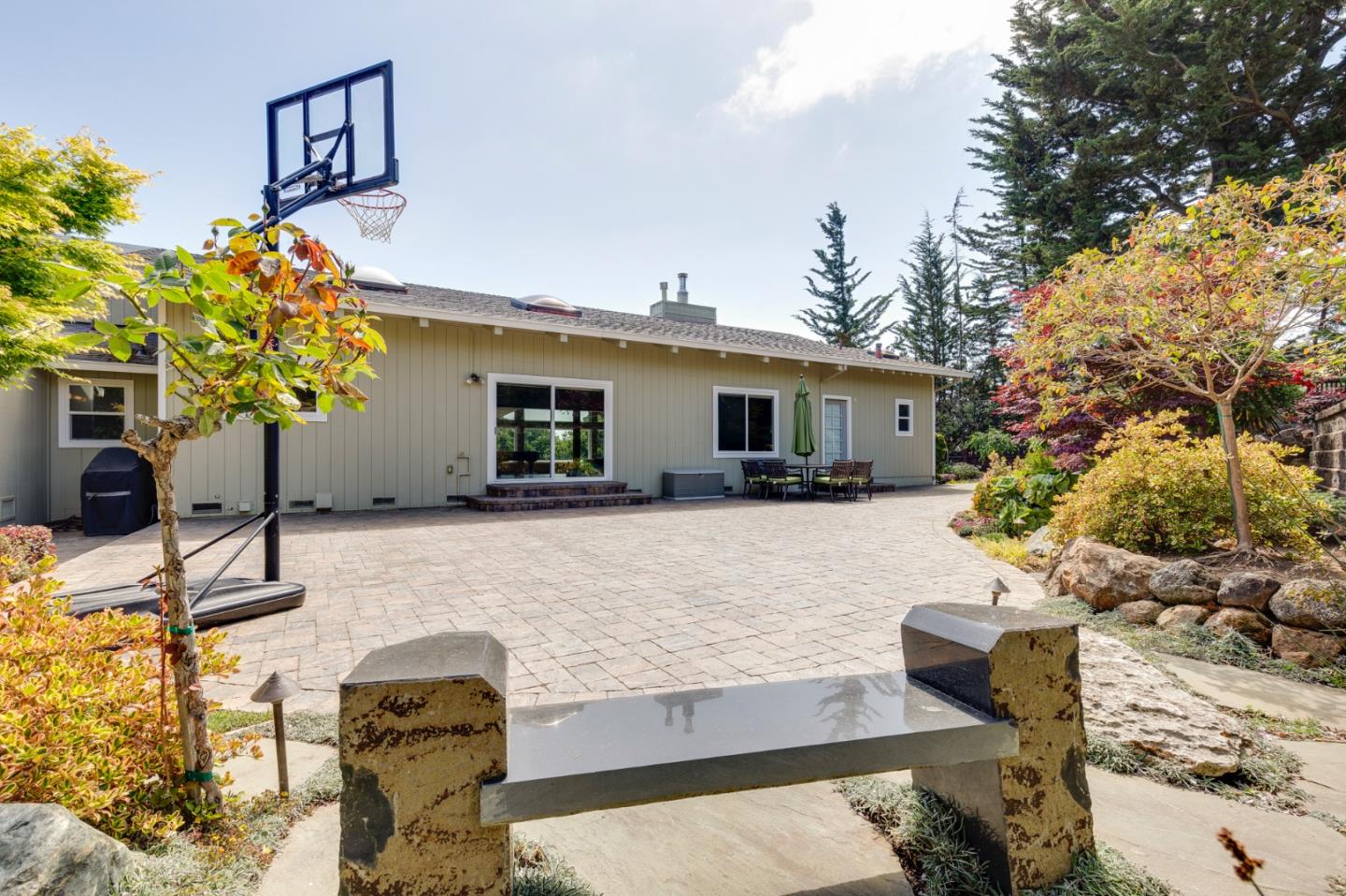 36 Tobin Clark Drive Hillsborough, CA 94010 - Photo 45 of 50 a front view of a house with a yard and a tree