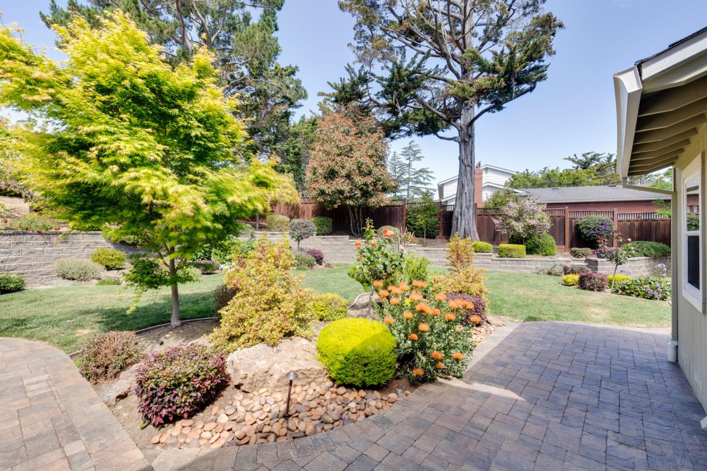 36 Tobin Clark Drive Hillsborough, CA 94010 - Photo 48 of 50 a view of a garden with a bench in patio