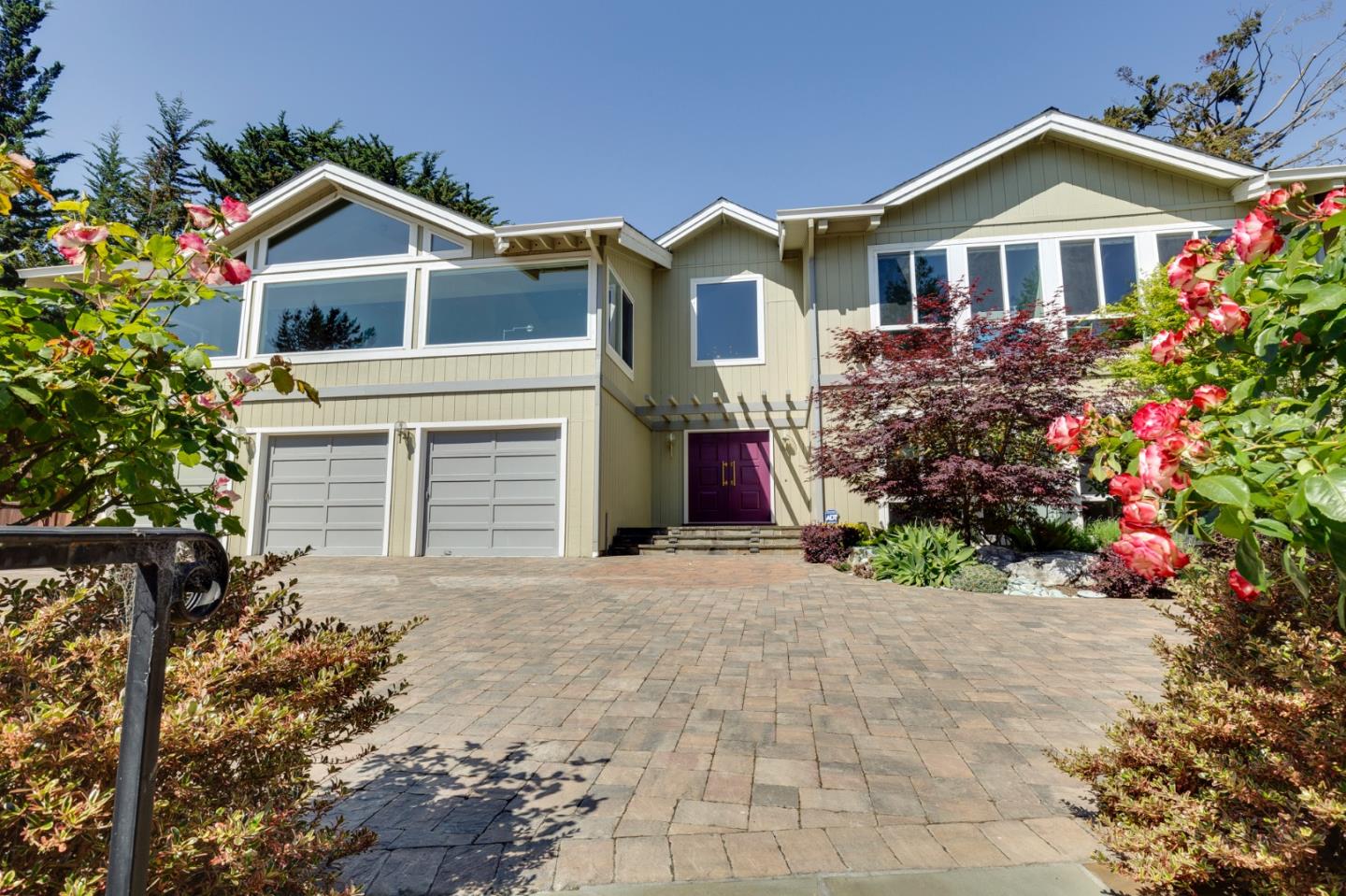36 Tobin Clark Drive Hillsborough, CA 94010 - Photo 5 of 50 a front view of a house with a yard and garage