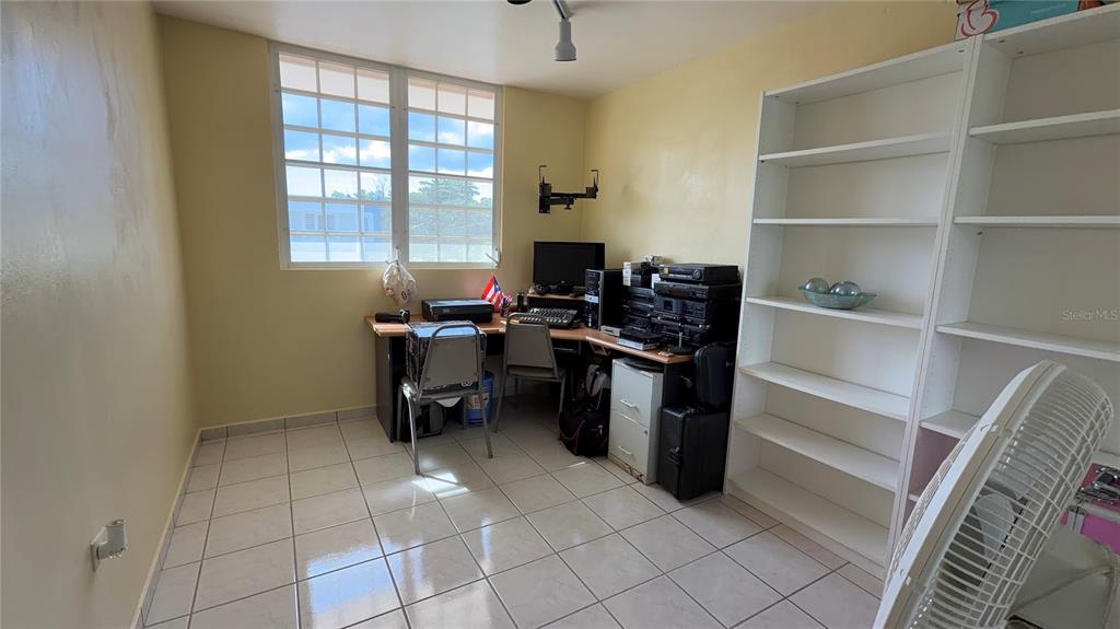 1 St Rio Grande, Unit B6 Rio Grande, PR 00745 - Photo 43 of 47 a kitchen with a sink a stove and a microwave
