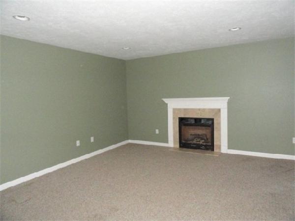 9 Vinton Road Sturbridge, MA 01566 - Photo 3 of 12 a view of an empty room with a fireplace