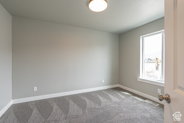2242 South 1120 West, Unit 69 Logan, UT 84321 - Photo 15 of 26 Empty room with carpet and baseboards