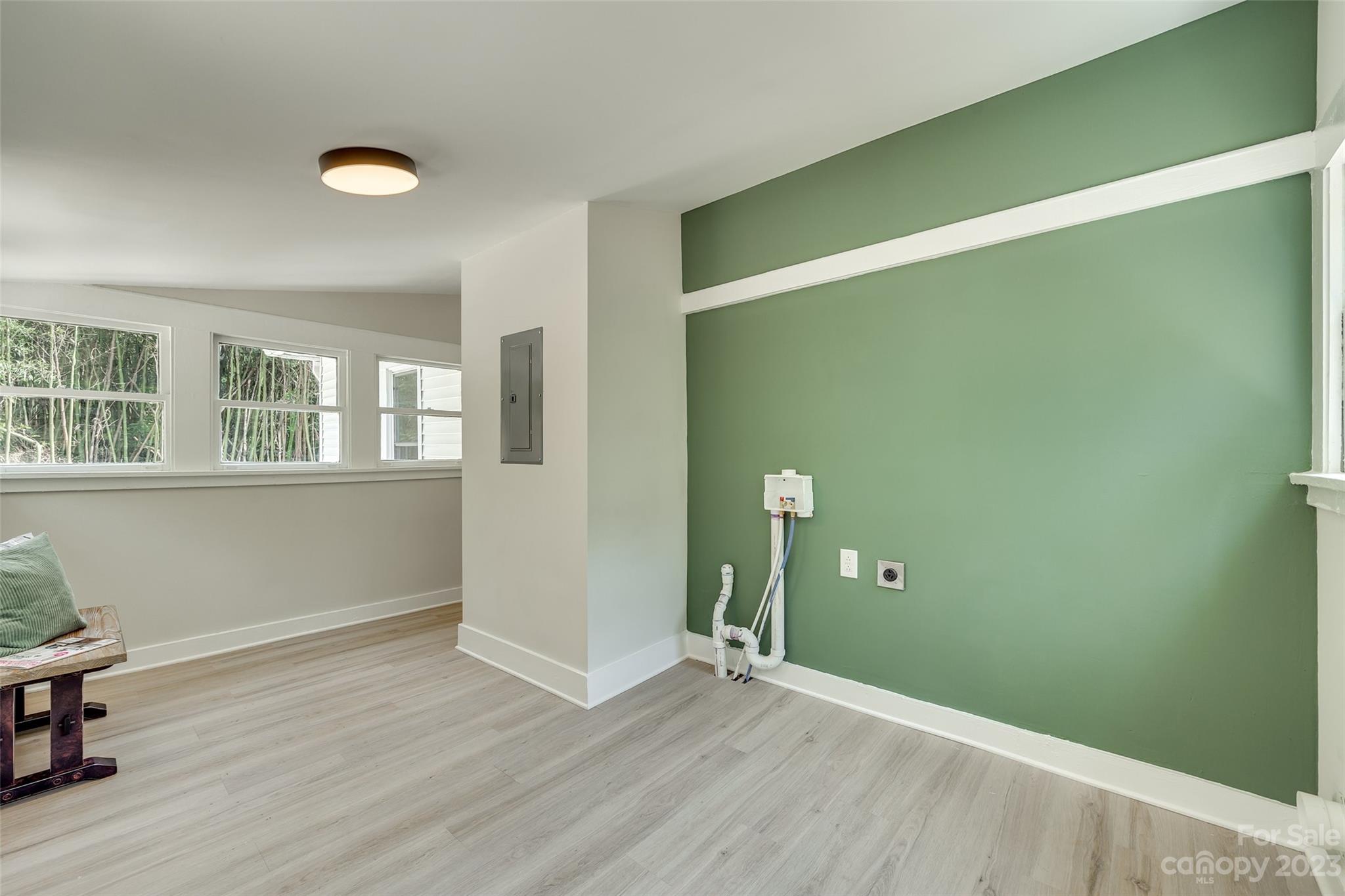 4595 Edgeland Road Edgemoor, SC 29712 - Photo 15 of 20 an empty room with wooden floor and windows