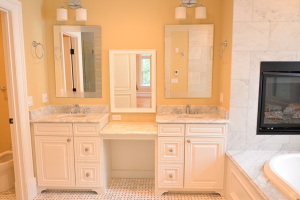 105 Naples Road Brookline, MA 02446 - Photo 3 of 13 a bathroom with a sink vanity granite tub and a mirror
