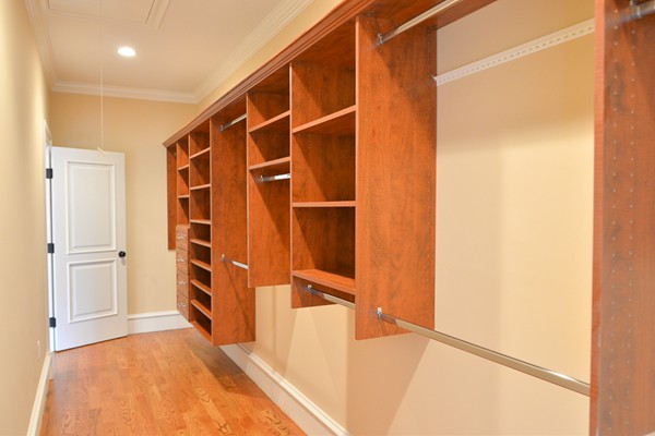 105 Naples Road Brookline, MA 02446 - Photo 9 of 13 a view of walk in closet with empty racks