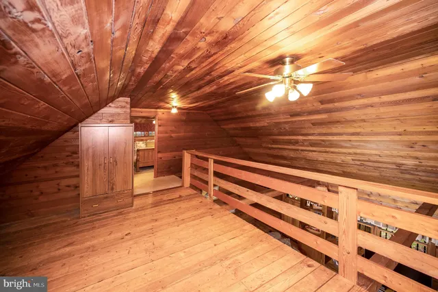 a bed room with a bed and a television