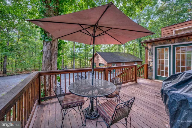 a view of a wooden deck with furniture