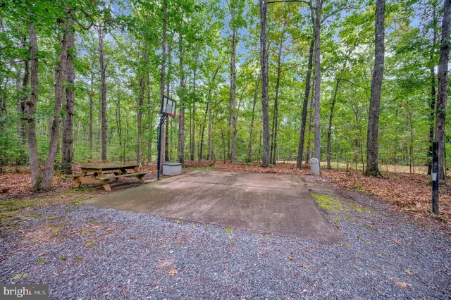 a view of a house with a yard porch and sitting area