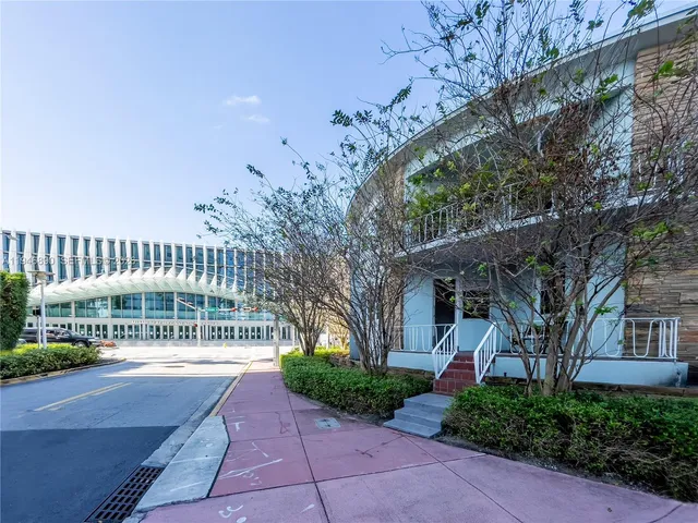 a view of a building with a garden