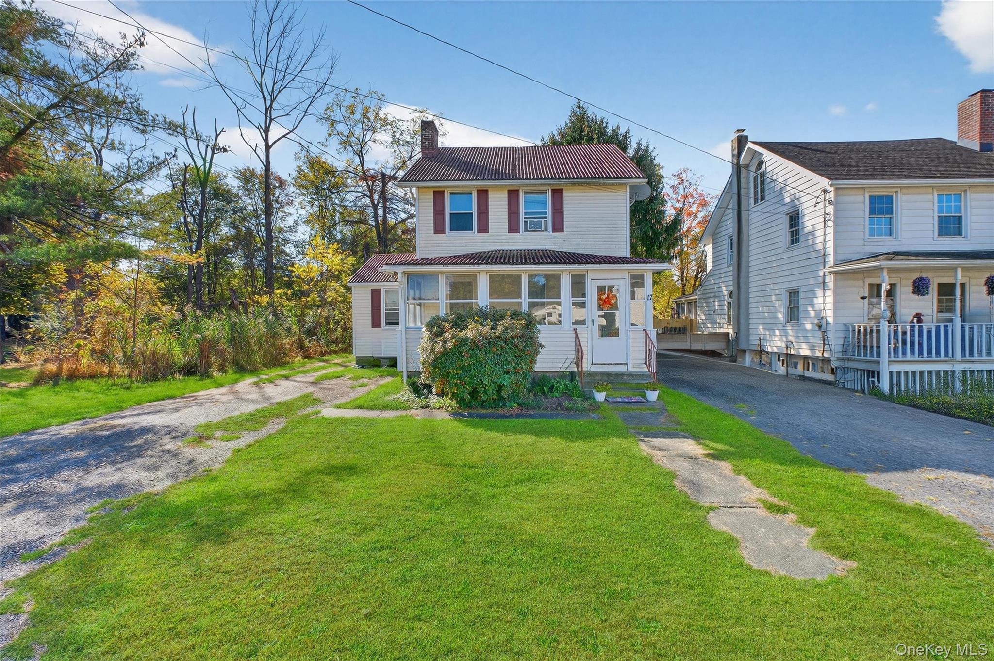 17 Fishkill Hook Road Hopewell Junction, NY 12533 - Photo 1 of 29 a front view of a house with yard and green space