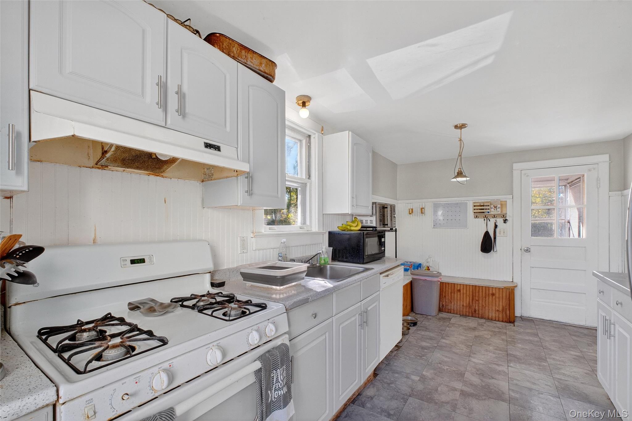 17 Fishkill Hook Road Hopewell Junction, NY 12533 - Photo 13 of 29 a kitchen with a stove and a refrigerator