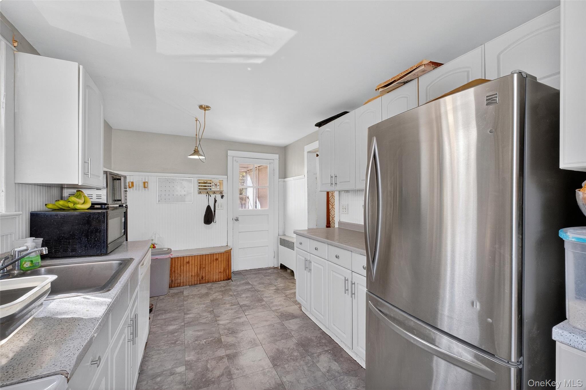 17 Fishkill Hook Road Hopewell Junction, NY 12533 - Photo 14 of 29 a large kitchen with stainless steel appliances a refrigerator and a stove top oven