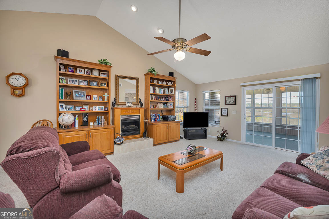 1056 Fiddler Trace Townsend, GA 31331 - Photo 11 of 36 a living room with furniture and a flat screen tv