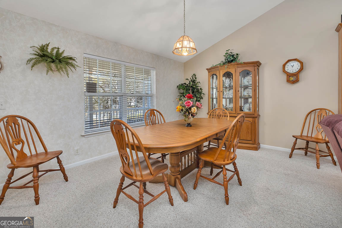 1056 Fiddler Trace Townsend, GA 31331 - Photo 12 of 36 a dining room with furniture and window