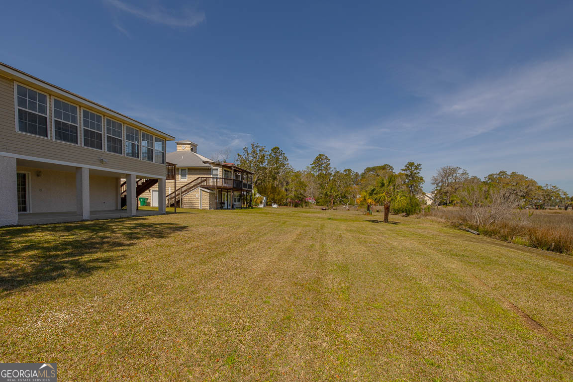 1056 Fiddler Trace Townsend, GA 31331 - Photo 15 of 36 a view of an house with swimming pool