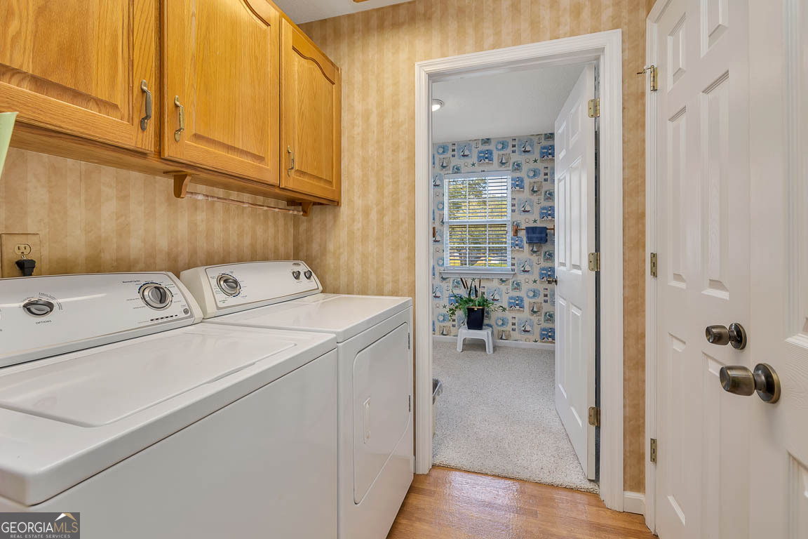 1056 Fiddler Trace Townsend, GA 31331 - Photo 22 of 36 a utility room with dryer and washer