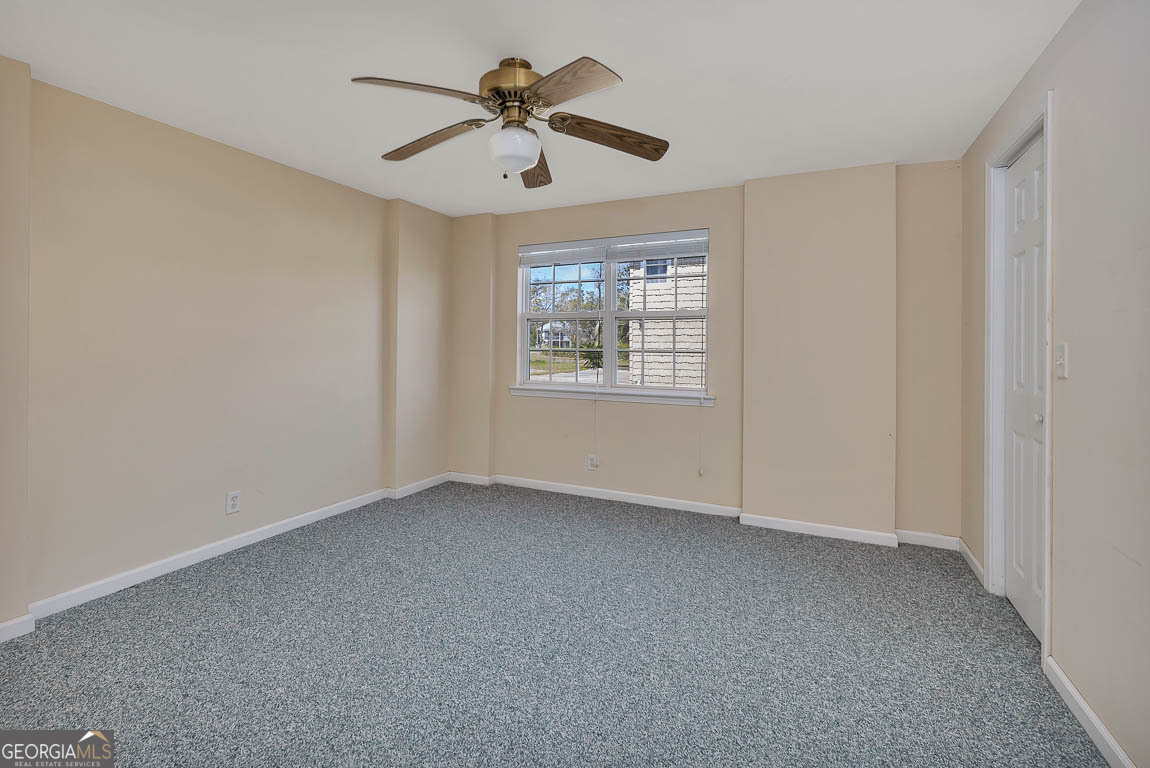 1056 Fiddler Trace Townsend, GA 31331 - Photo 26 of 36 an empty room with windows and fan