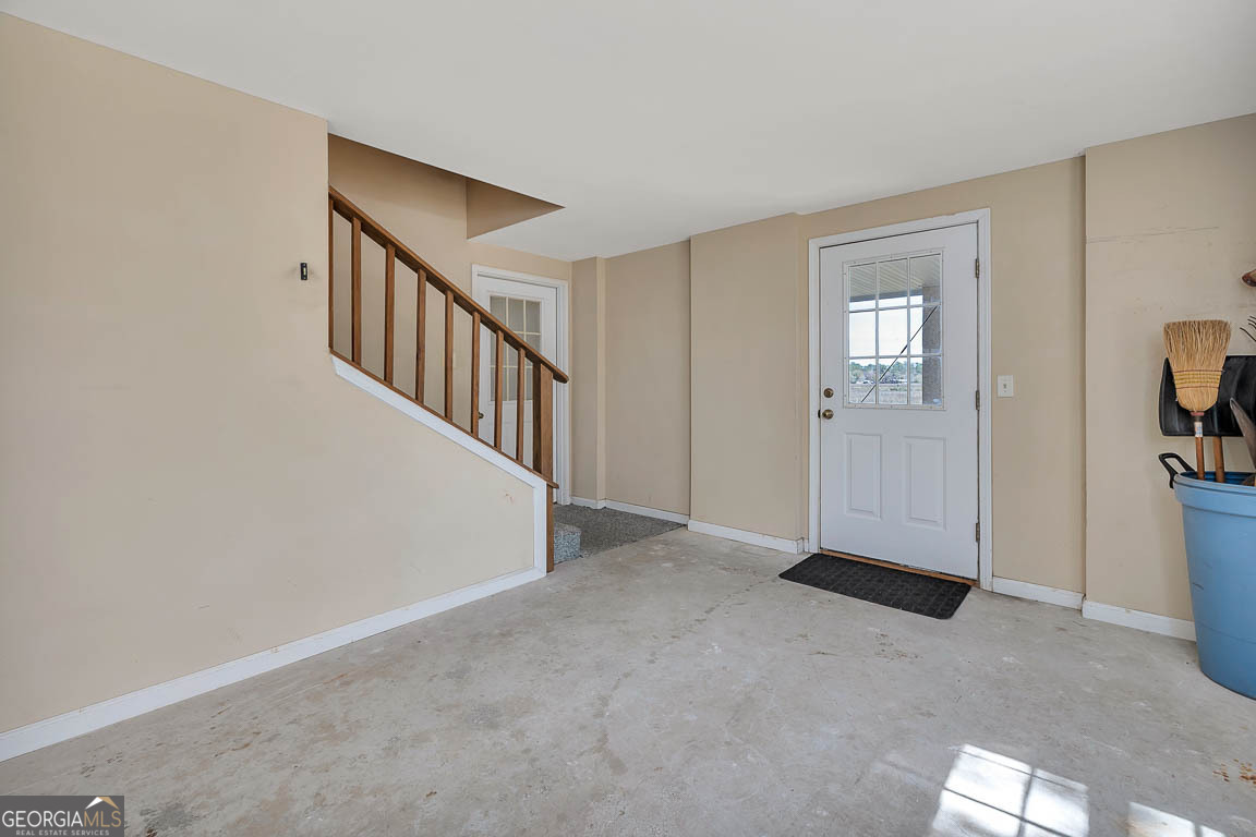 1056 Fiddler Trace Townsend, GA 31331 - Photo 27 of 36 a view of an empty room with stairs